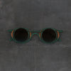 Rigards x ZIGGY CHEN RG1943ZC Titanium Magnetic Clip-On Sunglasses. RG-RG1943ZC-BLQTKTMQTL. Dark green bronze frame with dark green frame, transparent lenses, and bronze blue lenses.